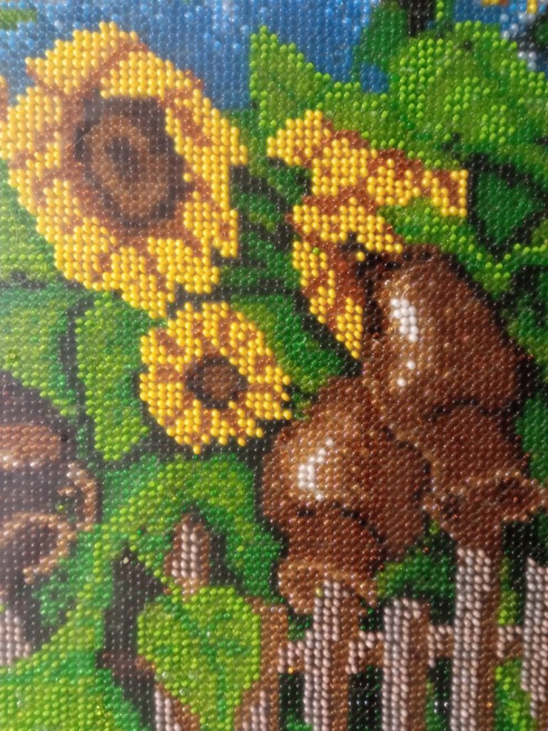 Bead-embroidered Sunflowers Painting: A Symbol of Joy and a Charitable Initiative
